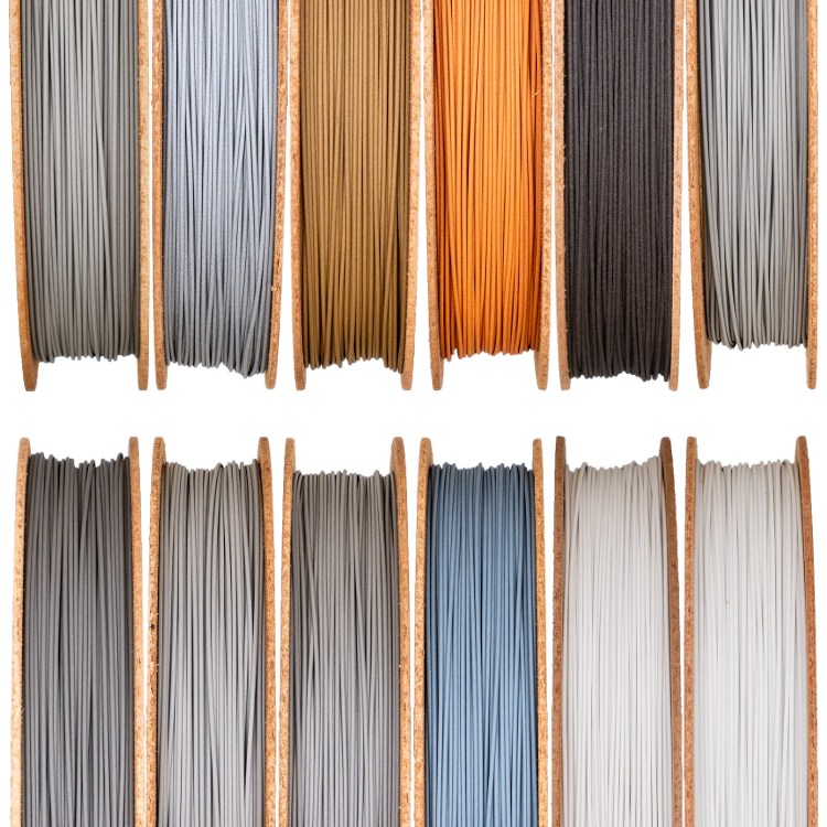 Metal Filament A set of different colored filaments, including copper filament, in a wooden box.