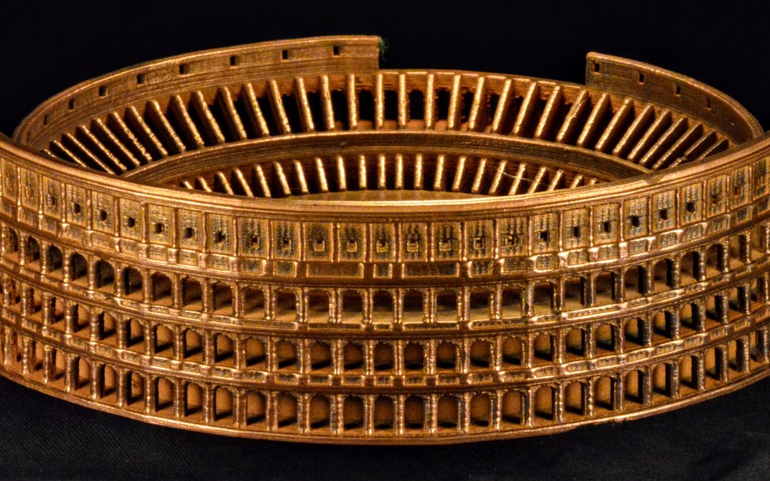 3D printed model of the Colosseum in bronze-like finish, showcasing intricate architectural details and layers, relevant to metal 3D printing applications by The Virtual Foundry.