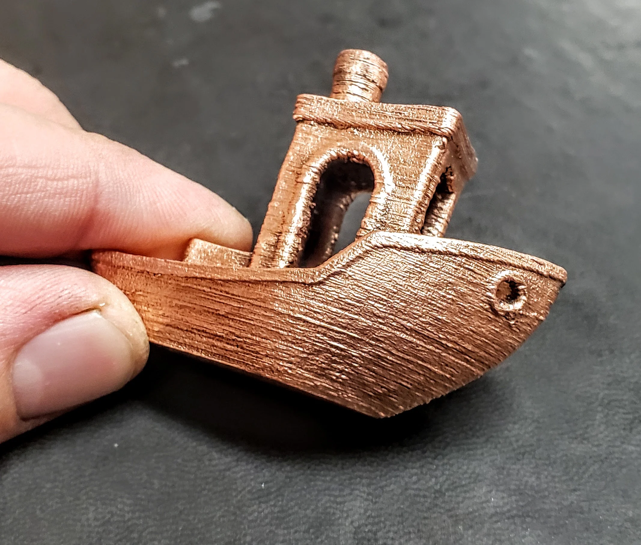 Metal 3D printing demonstration showcasing The Virtual Foundry's Filamet™ materials and applications in innovative designs.