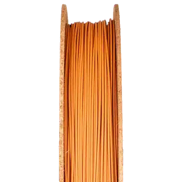 Copper 3D printing filament displayed on a spool, showcasing its vibrant orange color, relevant to sintering processes in metal and ceramic 3D printing.