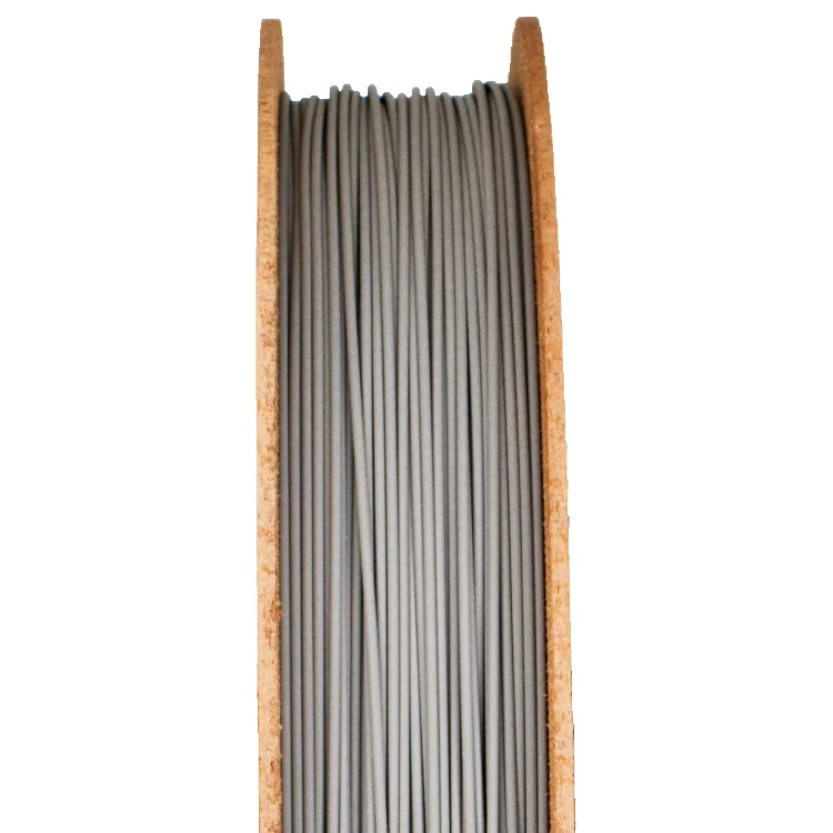 Gray H13 tool steel filament on a wooden spool, representing advanced materials for metal 3D printing and sintering processes.