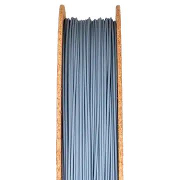 Silicon carbide filament displayed in a wooden spool, used for metal 3D printing applications.