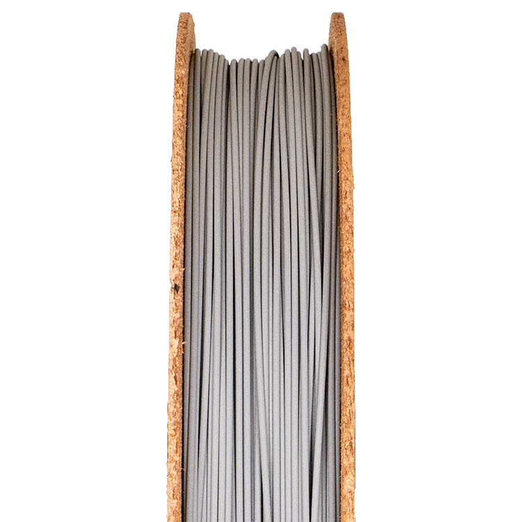 Stainless Steel 316L filament spool for 3D printing, showcasing smooth, gray strands in a wooden holder.